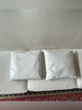 Two Faux Leather White Square Throw Pillows